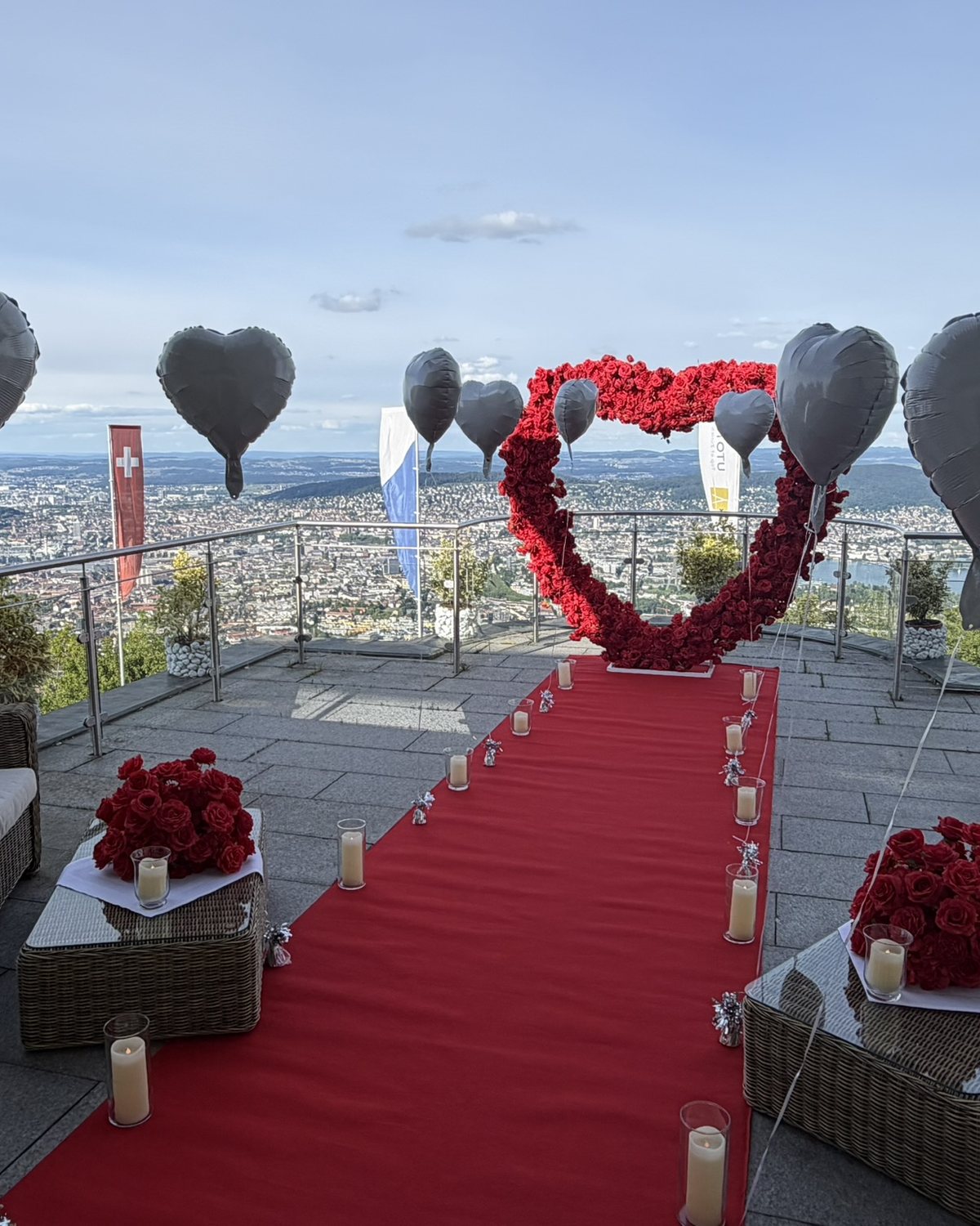 Red rose heart and red carpet on a hilltop terrace above Zurich